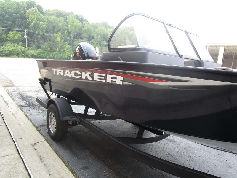 Slide: The Image of 2026 Tracker Pro Guide V175 CB boat on trailer, parked outdoors. - 9