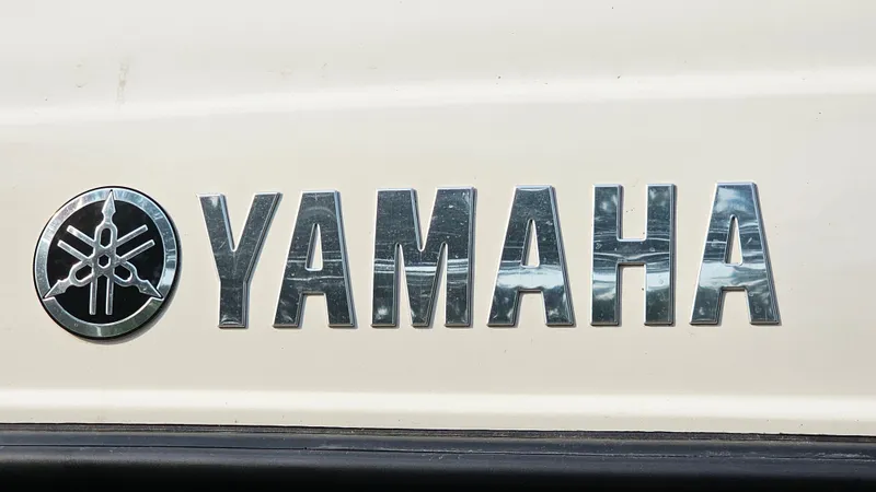 Slide: The Image of Yamaha logo on 2011 Yamaha Boats SX210, metallic lettering on white background. - 19