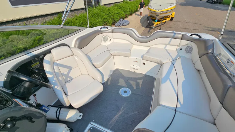 Slide: The Image of 2011 Yamaha Boats SX210 interior with white seating and steering wheel. - 7