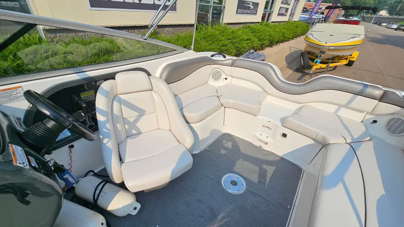 Slide: The Image of 2011 Yamaha Boats SX210 interior with seating and steering wheel, showcasing modern design. - 9
