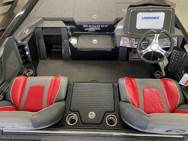 Slide: The Image of 2023 Ranger Z518 boat interior with red seats and Lowrance navigation system. - 3