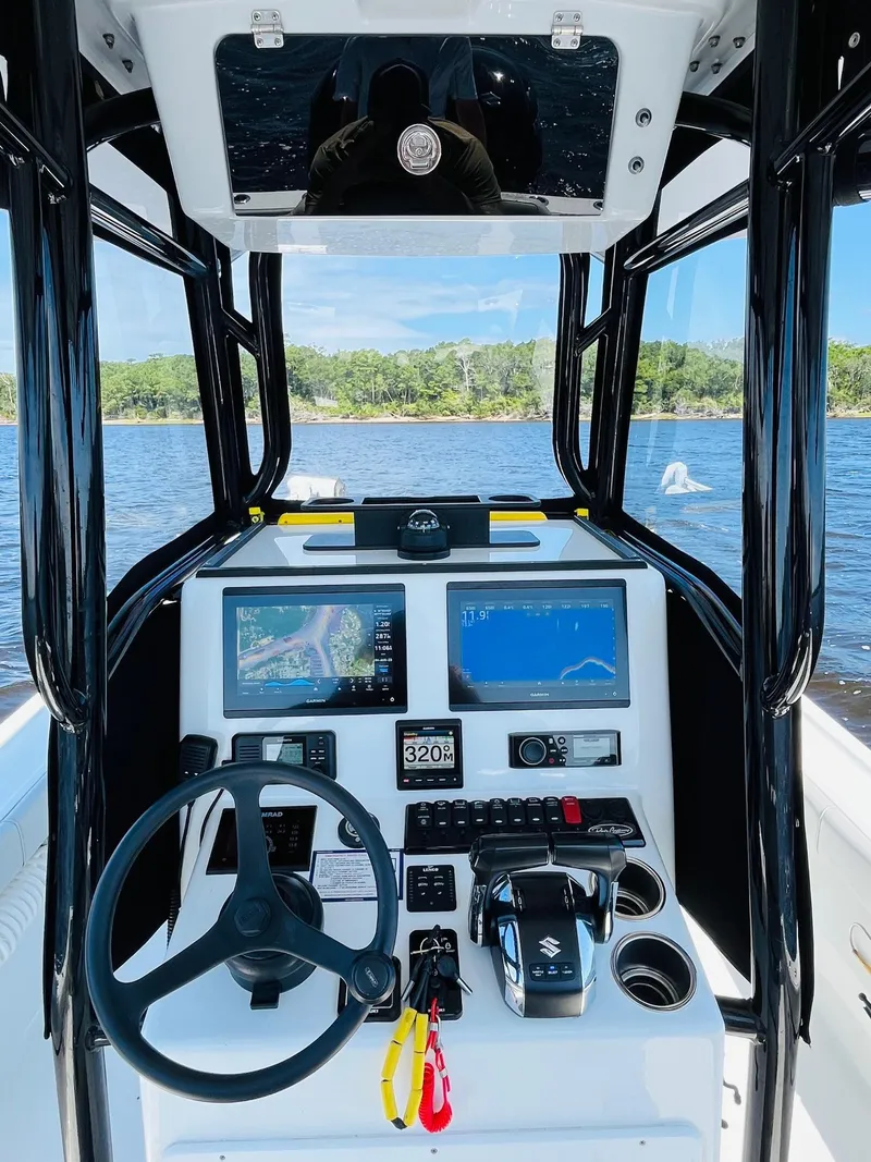 Slide: The Image of 2023 Pair Customs 24 Center Console DV boat interior with sleek design and modern features. - 11