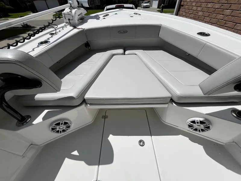 Slide: The Image of 2023 Pair Customs 24 Center Console DV boat on water, featuring sleek design and Garmin equipment. - 3