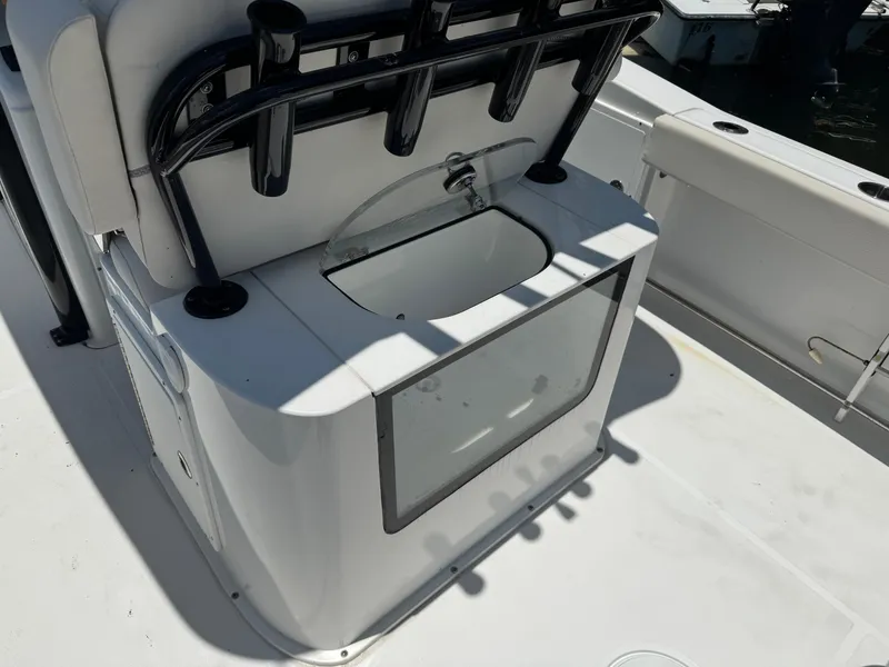Slide: The Image of 2024 Sea Hunt Gamefish 27 boat with forward seating and fishing rod holders. - 26