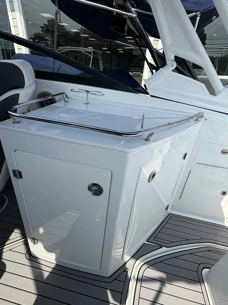 Slide: The Image of 2023 Monterey M65 boat interior with sleek white cabinetry and modern design. - 10