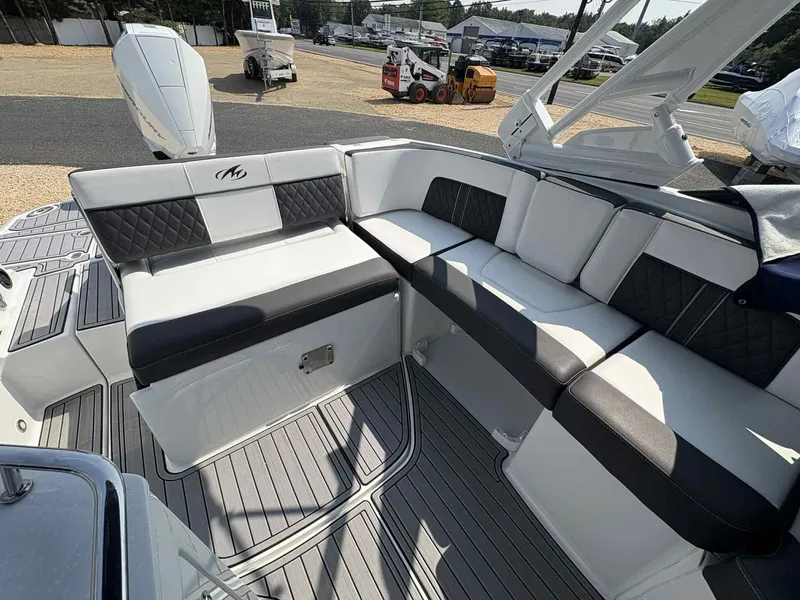Slide: The Image of 2023 Monterey M65 boat interior with stylish seating and modern design. - 12