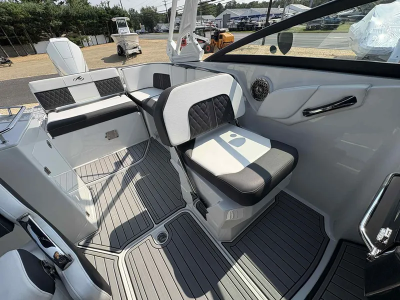 Slide: The Image of 2023 Monterey M65 boat interior with sleek seating and modern design. - 17