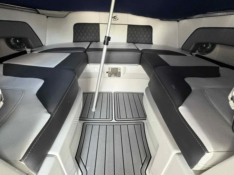 Slide: The Image of Luxurious interior of 2023 Monterey M65 boat with cushioned seating and sleek design. - 20