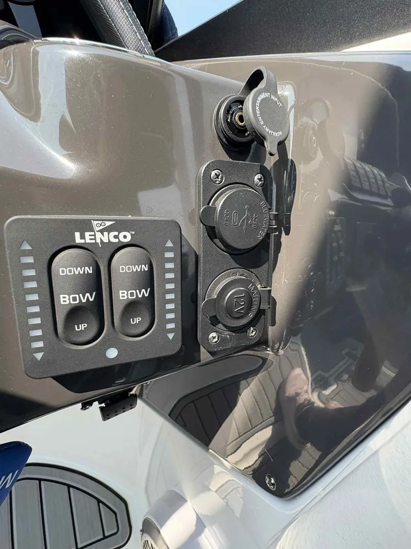 Slide: The Image of Control panel of 2023 Monterey M65 boat with Lenco trim tab switches. - 25