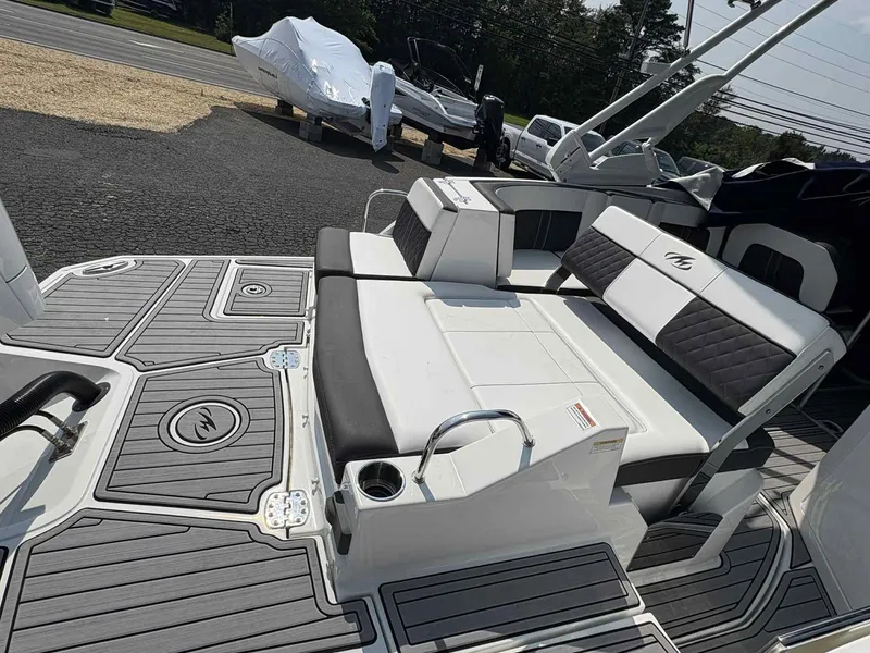 Slide: The Image of 2023 Monterey M65 boat interior with stylish seating and modern deck design. - 9