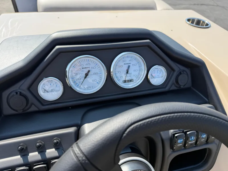 Slide: The Image of Dashboard of 2026 Bentley Pontoons Legacy 223 Navigator with gauges and controls. - 15