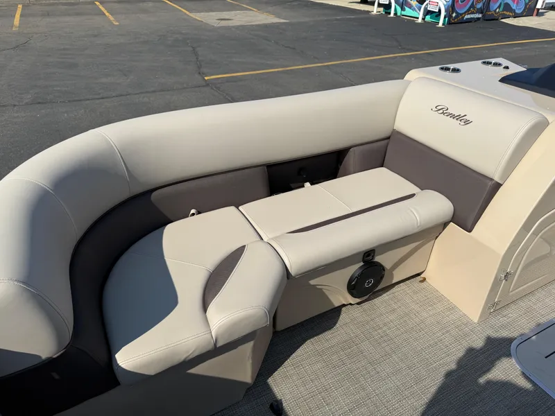 Slide: The Image of 2026 Bentley Pontoons Legacy 223 Navigator interior seating with beige and gray upholstery. - 16