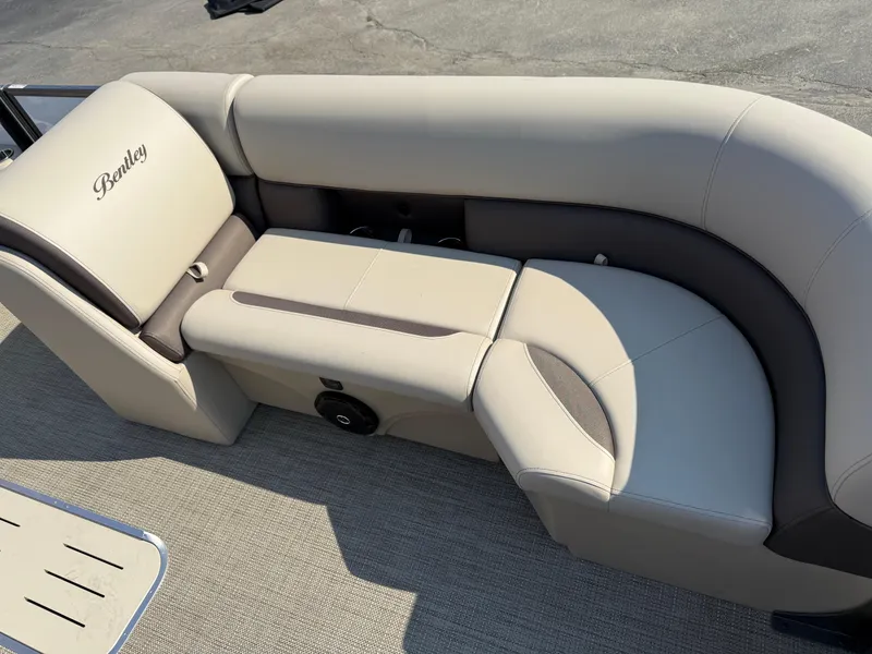 Slide: The Image of 2026 Bentley Pontoons Legacy 223 Navigator seating with beige upholstery and elegant design. - 18