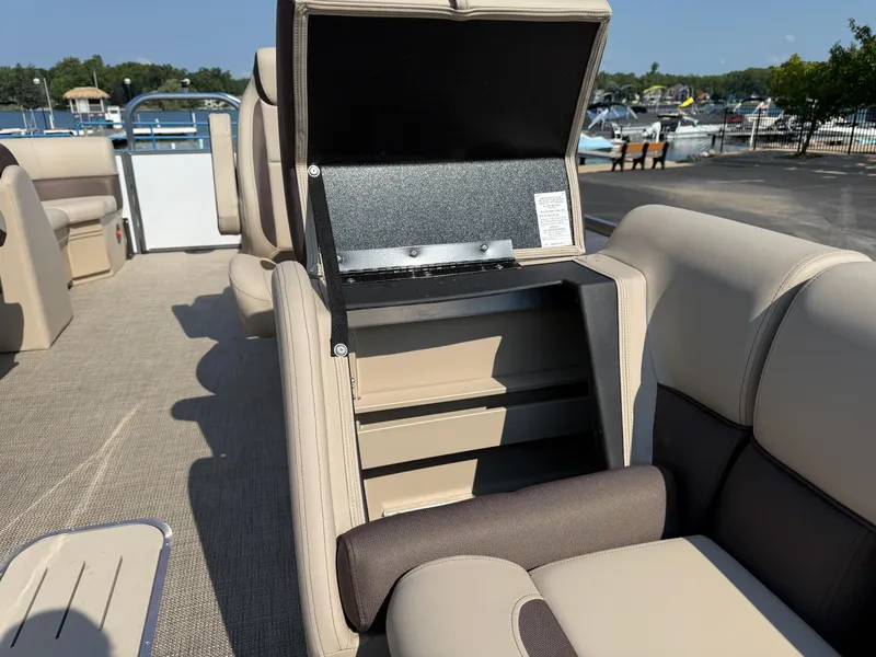 Slide: The Image of 2026 Bentley Pontoons Legacy 223 Navigator interior with open storage compartment. - 21