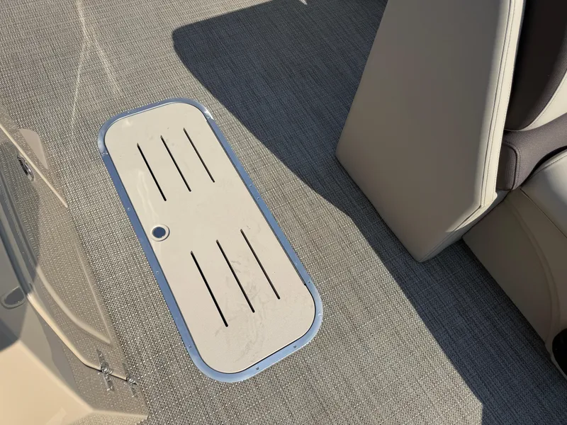 Slide: The Image of 2026 Bentley Pontoons Legacy 223 Navigator interior floor detail with storage compartment. - 22