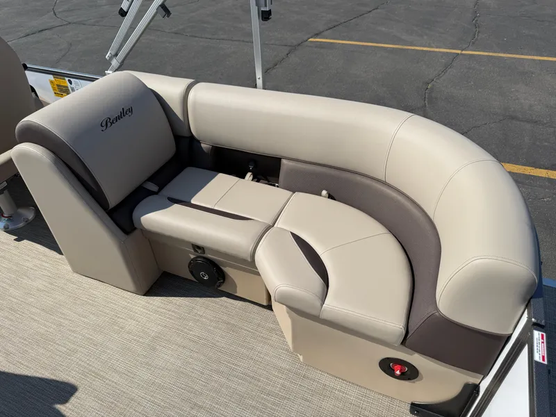 Slide: The Image of Luxurious seating on 2026 Bentley Pontoons Legacy 223 Navigator, featuring beige and brown upholstery. - 33