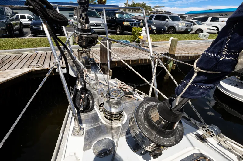 Slide: The Image of Deck view of a 2004 Hylas 46 yacht docked at a marina. - 2