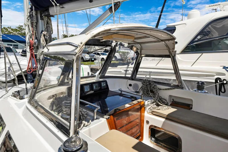 Slide: The Image of 2004 Hylas 46 sailboat cockpit with clear canopy, ropes, and navigation instruments. - 20