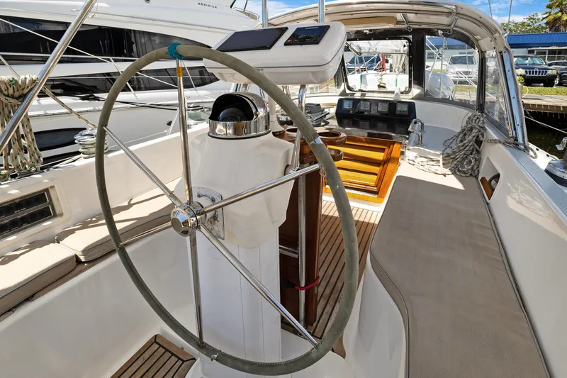 Slide: The Image of 2004 Hylas 46 yacht cockpit with steering wheel and navigation instruments. - 26