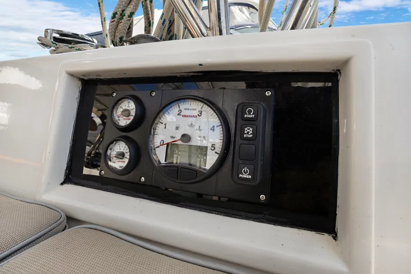 Slide: The Image of Control panel of a 2004 Hylas 46 yacht with gauges and buttons. - 27
