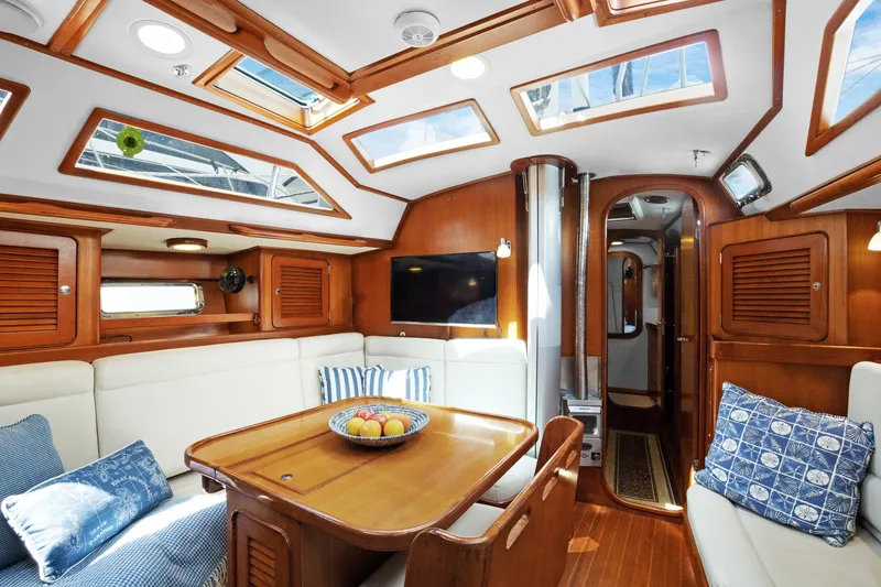 Slide: The Image of Luxurious interior of a 2004 Hylas 46 yacht with skylights and elegant wood finish. - 30