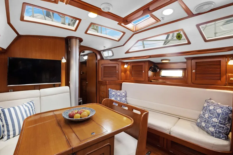 Slide: The Image of Luxurious 2004 Hylas 46 yacht interior with elegant wood finish and comfortable seating. - 31