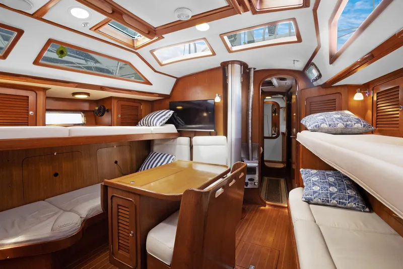 Slide: The Image of Luxurious interior of a 2004 Hylas 46 yacht with wooden finishes and skylights. - 35