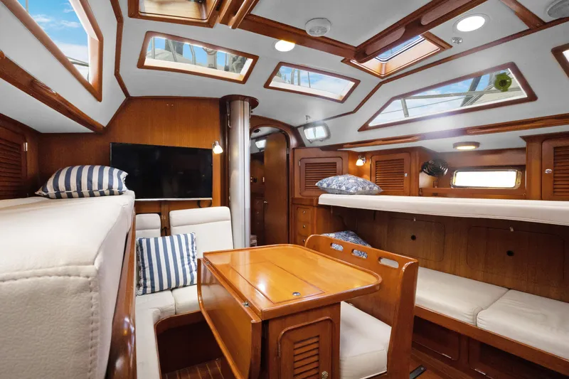 Slide: The Image of Luxurious interior of 2004 Hylas 46 yacht with skylights and wooden furnishings. - 36