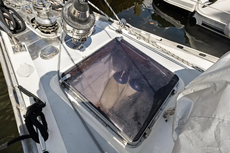 Slide: The Image of Deck of 2004 Hylas 46 yacht with winches and hatch, docked in marina. - 4