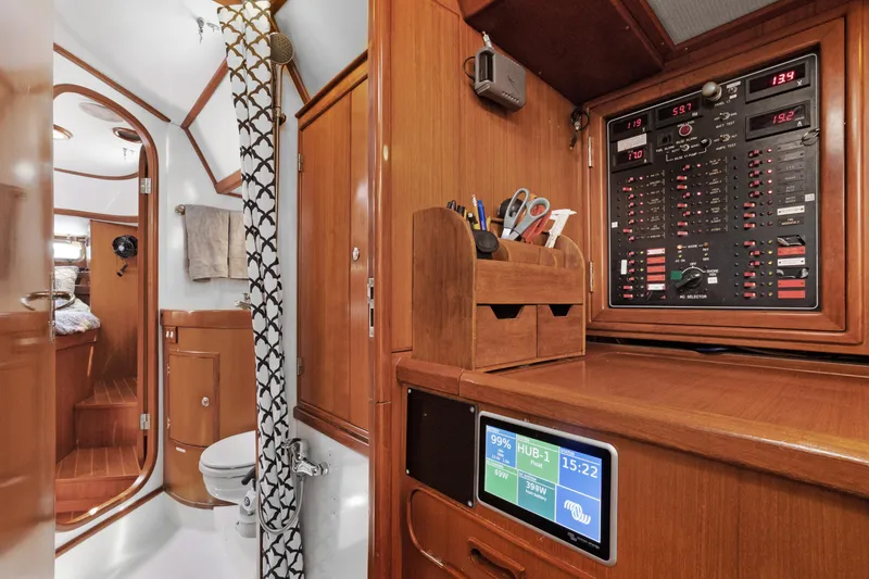 Slide: The Image of Interior of 2004 Hylas 46 yacht with control panel and bathroom. - 41