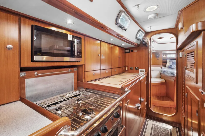Slide: The Image of Luxurious 2004 Hylas 46 yacht interior with modern kitchen and cozy cabin. - 45