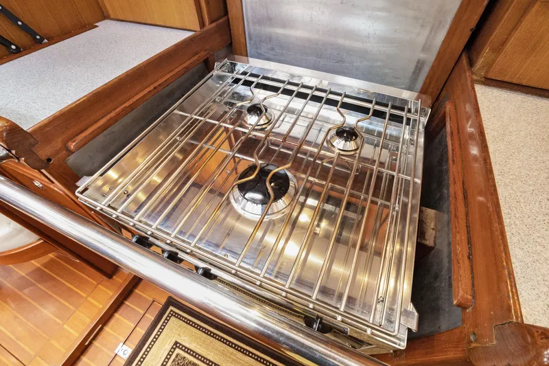 Slide: The Image of Stainless steel stove in 2004 Hylas 46 yacht kitchen, featuring three burners. - 48