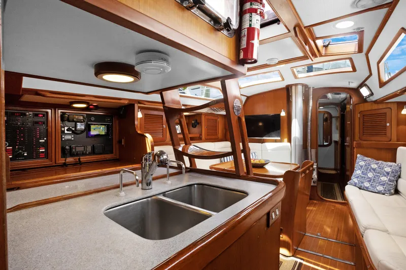 Slide: The Image of Interior of 2004 Hylas 46 yacht with modern kitchen and cozy seating area. - 51