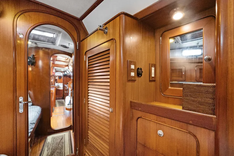 Slide: The Image of Interior of 2004 Hylas 46 yacht with wooden cabinetry and cozy cabin view. - 60