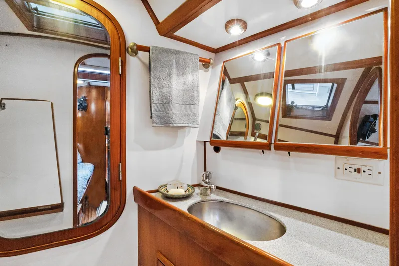 Slide: The Image of Luxurious bathroom interior of 2004 Hylas 46 yacht with wooden accents and modern fixtures. - 62