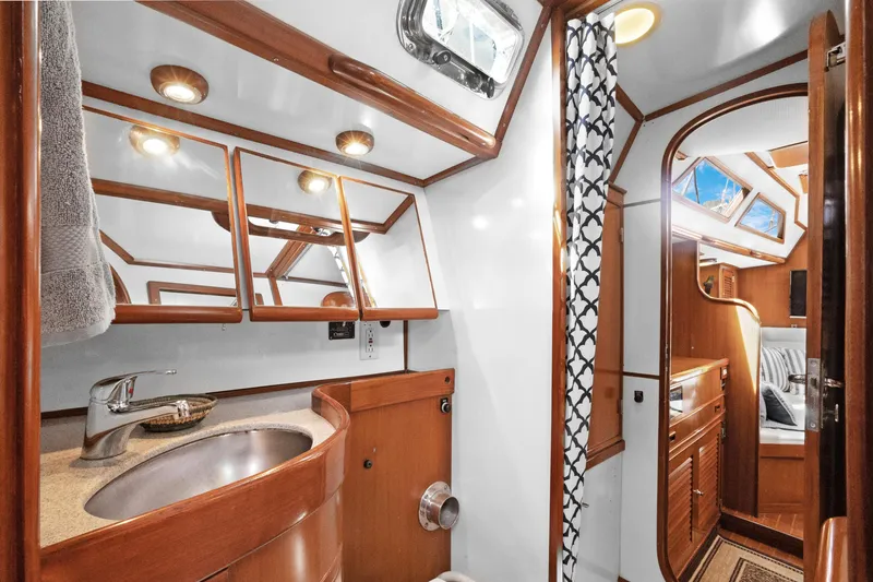 Slide: The Image of Luxurious 2004 Hylas 46 yacht interior with elegant wood finishes and modern amenities. - 68