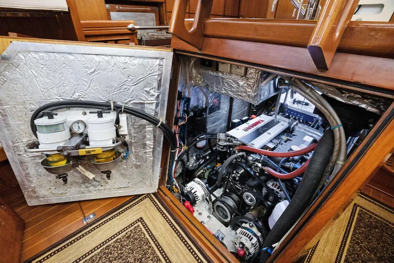 Slide: The Image of Engine room of a 2004 Hylas 46 yacht, showcasing detailed mechanical components. - 72