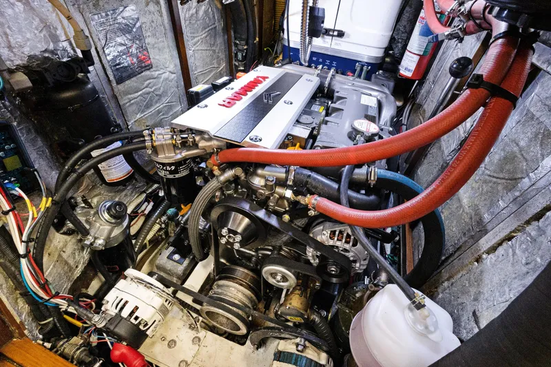 Slide: The Image of Engine compartment of a 2004 Hylas 46 yacht, featuring detailed mechanical components. - 73