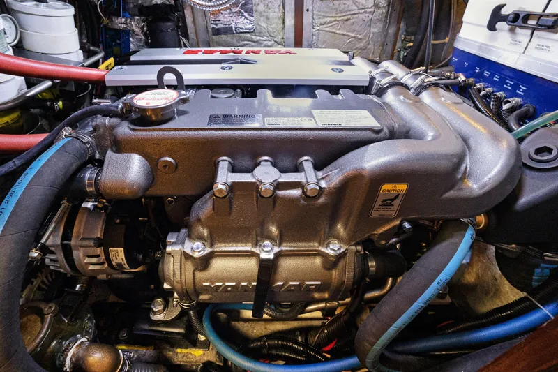 Slide: The Image of Engine compartment of a 2004 Hylas 46 yacht, featuring a Yanmar engine. - 75