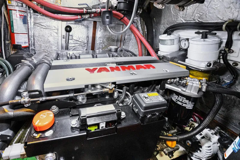 Slide: The Image of Engine room of a 2004 Hylas 46 yacht featuring a Yanmar engine. - 76