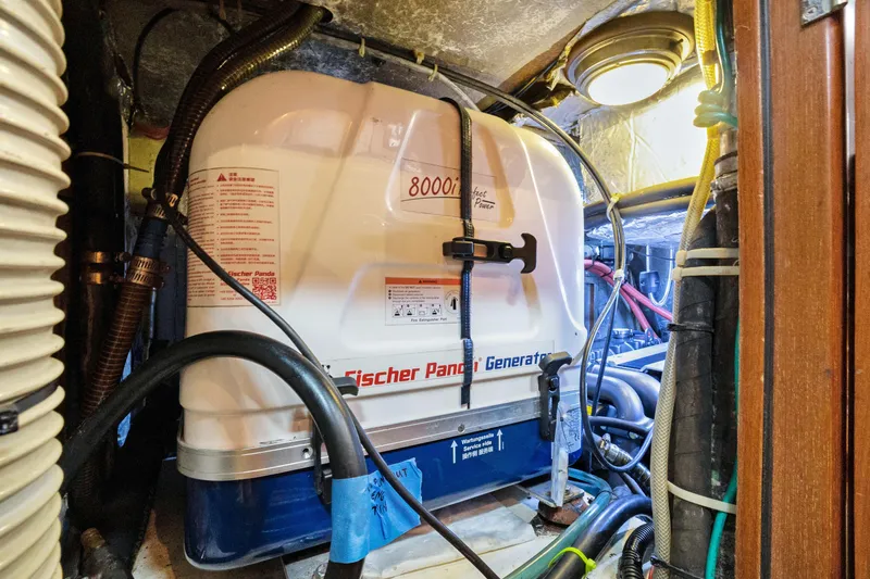 Slide: The Image of Engine room of a 2004 Hylas 46 yacht with Fischer Panda generator. - 78