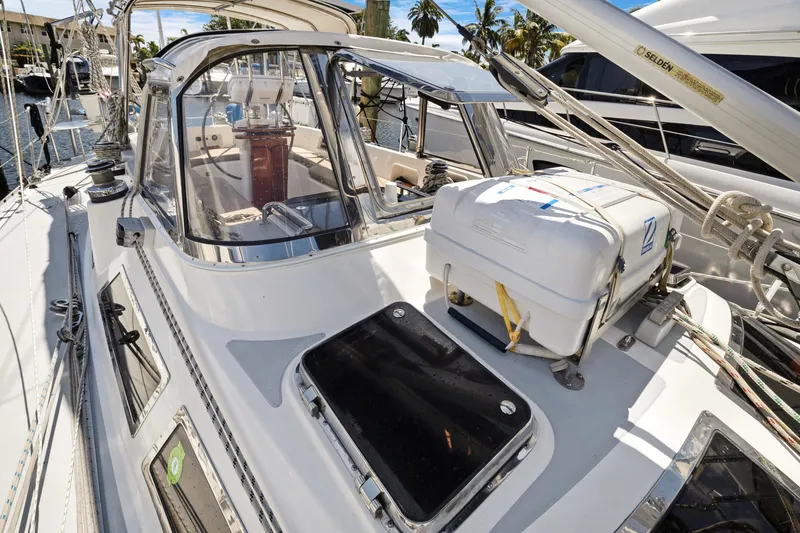 Slide: The Image of 2004 Hylas 46 sailboat deck with cockpit and rigging, docked in marina. - 9