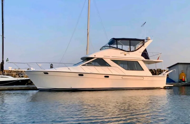 Slide: The Image of 2002 Bayliner 3988 yacht docked at marina during sunset. - 1