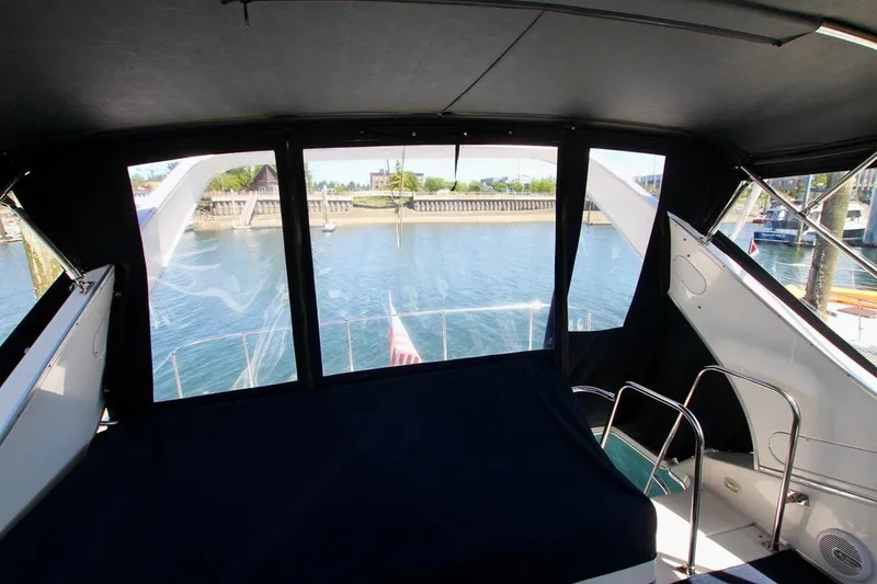 Slide: The Image of Interior view of 2002 Bayliner 3988 yacht with waterfront scenery. - 27