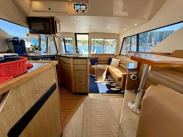 Slide: The Image of Interior of 2002 Bayliner 3988 yacht with cozy seating and modern kitchen. - 33