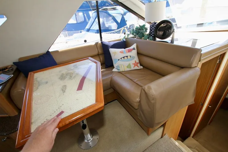 Slide: The Image of Interior of 2002 Bayliner 3988 yacht with leather seating and nautical decor. - 47