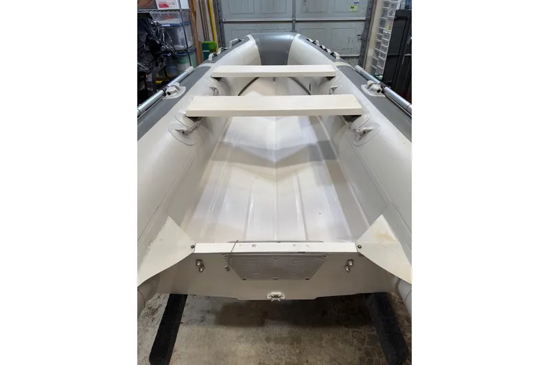 Slide: The Image of 2002 Bayliner 3988 Motoryacht interior view, showcasing seating and storage areas. - 84