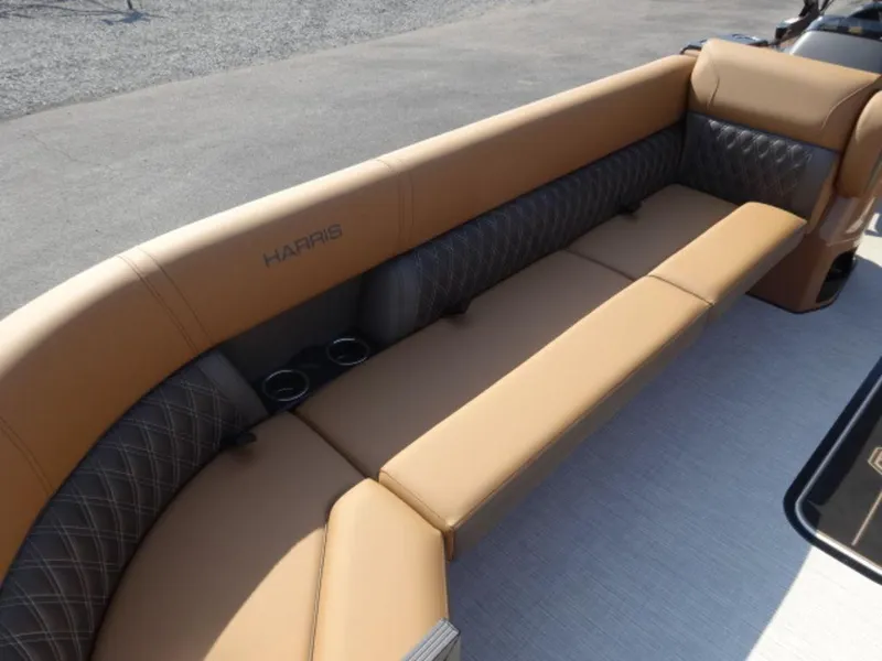 Slide: The Image of Luxurious seating on 2025 Harris Cruiser 250 LUX boat, featuring tan and gray upholstery. - 11