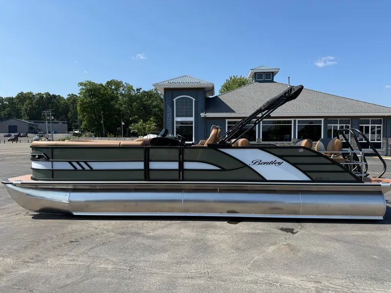 The Image of 2026 Bentley Pontoons Elite 253 QSB pontoon boat parked outdoors. - 0