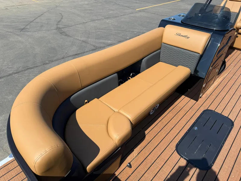 Slide: The Image of 2026 Bentley Pontoons Elite 253 QSB with luxurious tan seating and sleek design. - 14